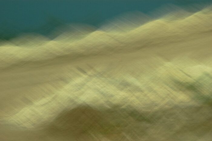 abstract photo art, a dune-like landscape with strong motion blur