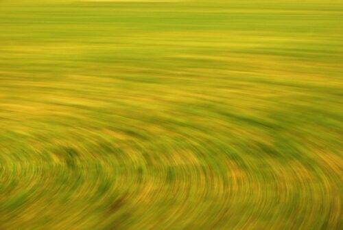 experimental photo art, a field turned into circular lines by motion
